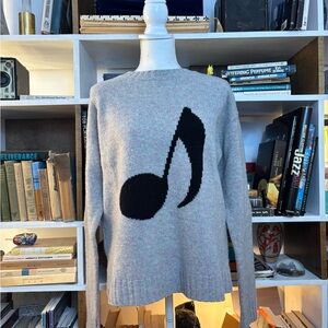 Acne Sweater with Black Music Note Design